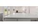 Large kitchen island with white quartz countertop at 1029 Blue Juniper Cir, Loganville, GA 30052