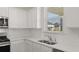Kitchen corner with white cabinets and quartz countertops at 1029 Blue Juniper Cir, Loganville, GA 30052