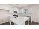 Modern kitchen featuring white cabinets, quartz countertops, and stainless steel appliances at 1029 Blue Juniper Cir, Loganville, GA 30052