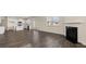 Open concept kitchen and living room with hardwood floors and island at 1029 Blue Juniper Cir, Loganville, GA 30052