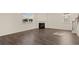 Living room with hardwood floors, fireplace, and natural light at 1029 Blue Juniper Cir, Loganville, GA 30052