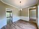 Bright dining room with hardwood floors and wainscoting at 1240 Falls Creek Ct, Conyers, GA 30094