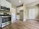 Kitchen with stainless steel appliances and white cabinets at 1240 Falls Creek Ct, Conyers, GA 30094