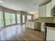 Open concept kitchen with island and stainless steel appliances at 1240 Falls Creek Ct, Conyers, GA 30094