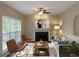Living room with fireplace, hardwood floors, and natural light at 1240 Falls Creek Ct, Conyers, GA 30094