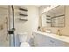 Modern bathroom with dual vanity, gold fixtures, and a frameless glass shower at 4485 Spring Valley Pkwy, Atlanta, GA 30349
