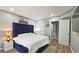 Main bedroom with a plush velvet headboard, plenty of space, and modern decor at 4485 Spring Valley Pkwy, Atlanta, GA 30349