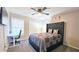 Guest bedroom with a queen bed, built-in desk, and plenty of natural light at 4485 Spring Valley Pkwy, Atlanta, GA 30349