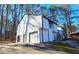 House exterior featuring a newly painted exterior, two-car garage, and deck at 4485 Spring Valley Pkwy, Atlanta, GA 30349