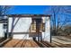 Back exterior showcasing a private deck and wooded area at 4485 Spring Valley Pkwy, Atlanta, GA 30349