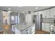 Updated kitchen boasting white cabinets, granite countertops, and a large island at 4485 Spring Valley Pkwy, Atlanta, GA 30349
