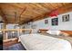 Large loft bedroom with exposed beams and wood ceiling at 170 Boulevard Se # H-221, Atlanta, GA 30312