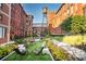 Community courtyard with lawn games and landscaping at 170 Boulevard Se # H-221, Atlanta, GA 30312