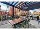 Outdoor kitchen and dining area with pergola at 170 Boulevard Se # H-221, Atlanta, GA 30312