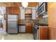 Sleek kitchen featuring stainless steel appliances and wood cabinetry at 170 Boulevard Se # H-221, Atlanta, GA 30312