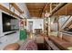 Open living area with leather sofa and large TV at 170 Boulevard Se # H-221, Atlanta, GA 30312