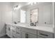 Elegant bathroom with double vanity, quartz countertops, and large mirror at 2615 Yellowstone Farm Dr, Cumming, GA 30028