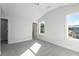 Bright bedroom with gray carpet, window, and closet at 2615 Yellowstone Farm Dr, Cumming, GA 30028