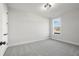 Bright bedroom with gray carpet and a window at 2615 Yellowstone Farm Dr, Cumming, GA 30028
