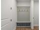 Built-in bench with cubbies and hooks in an entry hall at 2615 Yellowstone Farm Dr, Cumming, GA 30028