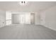 Spacious bonus room with gray carpeting and multiple doors at 2615 Yellowstone Farm Dr, Cumming, GA 30028