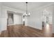 Bright dining room with hardwood floors and a chandelier at 2615 Yellowstone Farm Dr, Cumming, GA 30028