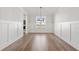 Bright dining room features hardwood floors and wainscoting at 2615 Yellowstone Farm Dr, Cumming, GA 30028