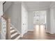 Open concept entryway with view to Gathering room and kitchen at 2615 Yellowstone Farm Dr, Cumming, GA 30028