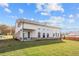 House exterior showcasing a sunroom and patio at 2615 Yellowstone Farm Dr, Cumming, GA 30028