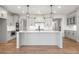Modern kitchen with gray cabinets, quartz countertops, and an island at 2615 Yellowstone Farm Dr, Cumming, GA 30028
