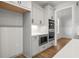 Modern kitchen with gray cabinets, quartz countertops, and stainless steel appliances at 2615 Yellowstone Farm Dr, Cumming, GA 30028