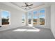 Main bedroom with tray ceiling, carpeting and abundant natural light at 2615 Yellowstone Farm Dr, Cumming, GA 30028