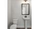 Modern powder room with pedestal sink and black accents at 2615 Yellowstone Farm Dr, Cumming, GA 30028