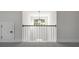 Upstairs hall with a chandelier and railing overlooking the foyer at 2615 Yellowstone Farm Dr, Cumming, GA 30028