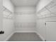 Spacious walk-in closet with wire shelving and hanging rods at 2615 Yellowstone Farm Dr, Cumming, GA 30028