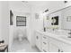 Modern bathroom with white cabinets and marble shower at 1066 Cleavemark Dr, Clarkston, GA 30021