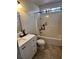 Bathroom with white vanity, bathtub, and tile flooring at 1299 Stampmill Way, Lawrenceville, GA 30043