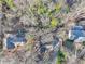 Aerial view showcasing a cluster of houses in a wooded setting at 2046 Kinridge Ct, Marietta, GA 30062