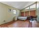 Simple bedroom with hardwood floors and a built-in workspace at 2046 Kinridge Ct, Marietta, GA 30062
