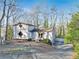 A unique two-story house nestled in a wooded area at 2046 Kinridge Ct, Marietta, GA 30062