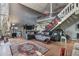 Spacious living room featuring high ceilings, a stone fireplace, and loft area at 2046 Kinridge Ct, Marietta, GA 30062