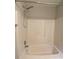 Clean bathroom features shower-tub combo with white porcelain tiling and shower head at 5140 Sky Ridge Way, Cumming, GA 30041