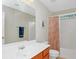 Bathroom with vanity and a mirror beside a shower and toilet at 5140 Sky Ridge Way, Cumming, GA 30041