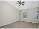 Spacious bedroom with carpeted floor and ceiling fan at 5140 Sky Ridge Way, Cumming, GA 30041