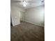 A bright bedroom features sliding closet doors and neutral walls and carpet at 5140 Sky Ridge Way, Cumming, GA 30041
