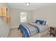 Cozy bedroom with a bed, modern accents, and soft natural light at 5140 Sky Ridge Way, Cumming, GA 30041