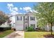Two-story house with gray siding, stone accents, and a grassy front yard at 5140 Sky Ridge Way, Cumming, GA 30041