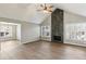 Spacious living room with vaulted ceiling, fireplace, and hardwood floors at 1020 Wellers Ct, Roswell, GA 30076