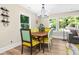 Elegant dining area with a wooden table and stylish chairs at 1836 Meadow Ln, Decatur, GA 30032