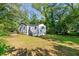 Side view of a white house with a spacious backyard at 1836 Meadow Ln, Decatur, GA 30032